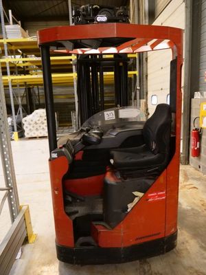a forklift truck with a driver in a warehouse