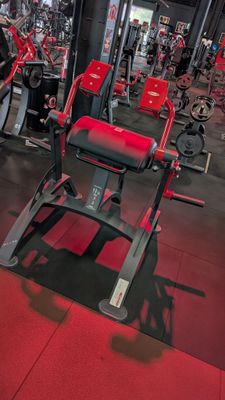 a gym with a lot of machines in the room