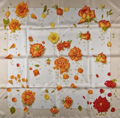 an image of a table cloth with orange roses on it