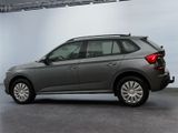 the rear end of a grey volkswagen suv parked in a garage