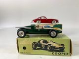 two toy cars that are sitting on top of a box