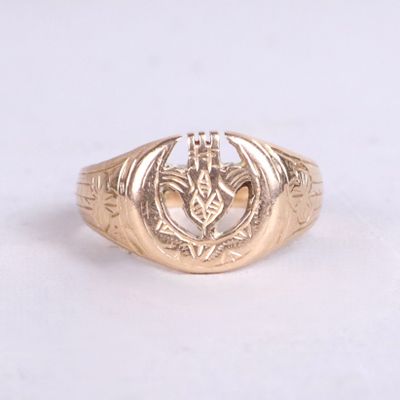 an image of a gold ring with a dragon on it