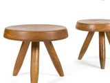 two small wooden stools with wooden legs on a white background