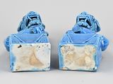 pair of chinese blue glazed figurines of a man and a woman