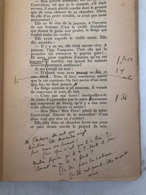 an old book with writing on it sitting on top of a table