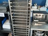 an image of a kitchen with a rack of food