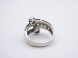 a close up of a silver ring on a white surface