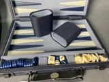 a suitcase with a game set in it on a table