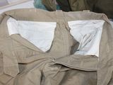 a close up of a piece of clothing on a bed