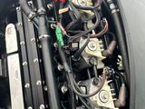 a close up of a car ' s engine with its hood open