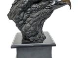 bronze sculpture of an eagle head on a marble base