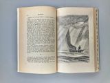 an open book with a drawing of a boat in the water