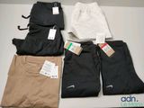 several pairs of men ' s nike sweatpants are on a table