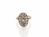 an antique diamond and emerald ring