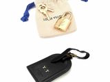 a small bag with a key and a keychain on it