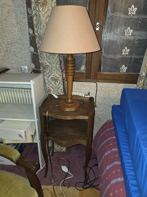 an image of a bedroom with a lamp and a bed