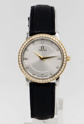 a close up of a wrist watch with a diamond bezel