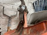 a pile of tools sitting on top of a wooden table