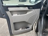 a car door open with a dog in it ' s seat