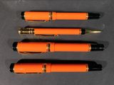 four different types of pens lined up on top of each other