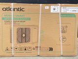three boxes of air conditioning units are stacked on top of each other