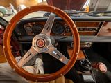 a steering wheel and dashboard of a car in a showroom