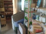 a room with a lot of boxes and boxes on the shelves