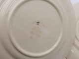 a white plate with a black and white design on it