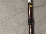 a wooden stick with a skull on it on the floor
