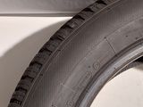a close up of a tire on the side of a car