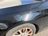 a close up of a car with a denting on it