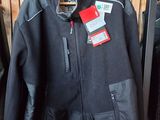 jacket hanging on a rack in a clothing store with a price tag on it