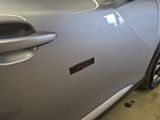 a close up of a car door with a sticker on it