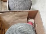 a box full of bottles and a glass bottle in it