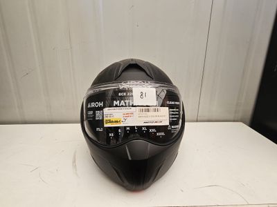 the helmet is black and has a sticker on it