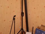 a picture of a camera and tripod stand in a room