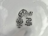 a close up of a white plate with a black and white design