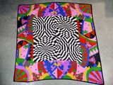 an image of a colorful blanket on the floor