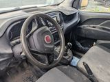 the interior of a small car with a steering wheel and dashboard