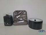 a bag and a roll of black tape on a table