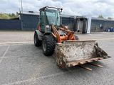 a tractor that is parked in the parking lot