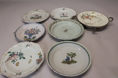 many plates that are sitting on a table