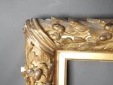 a picture of a gold frame with a picture on it