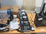 a table with a lot of electronics on top of it