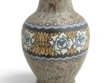a vase that is sitting on a white surface