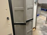 two refrigerators that are next to each other in a room