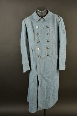 an image of a blue coat on a mannequin stand