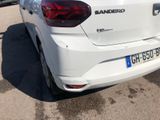 a white car that is parked in a parking lot