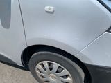 a car that has a broken tire on the side of the road