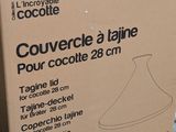 packaging for a large glass vase on a shelf in a store